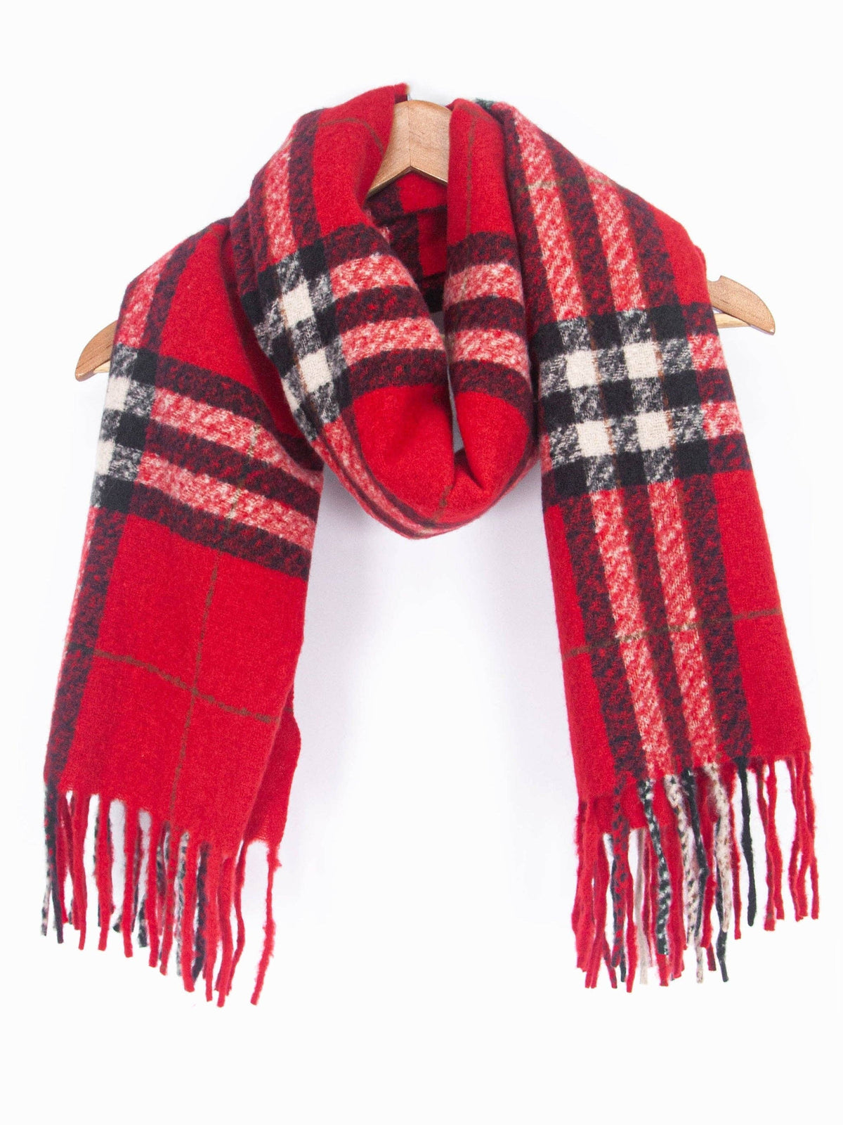 Red plaid scarf with black and white patterns on a wooden hanger against a white background