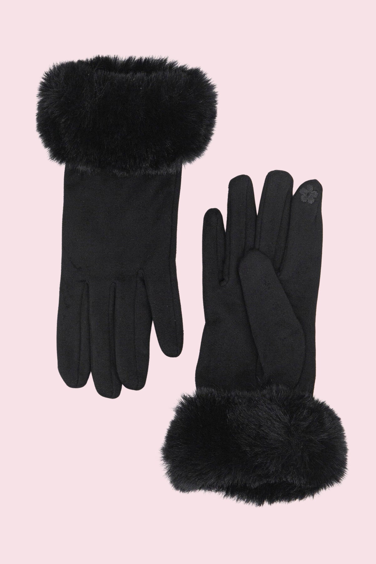 A pair of black gloves with fluffy black faux-fur trim at the cuffs and fingertips, displayed on a solid pale pink background.