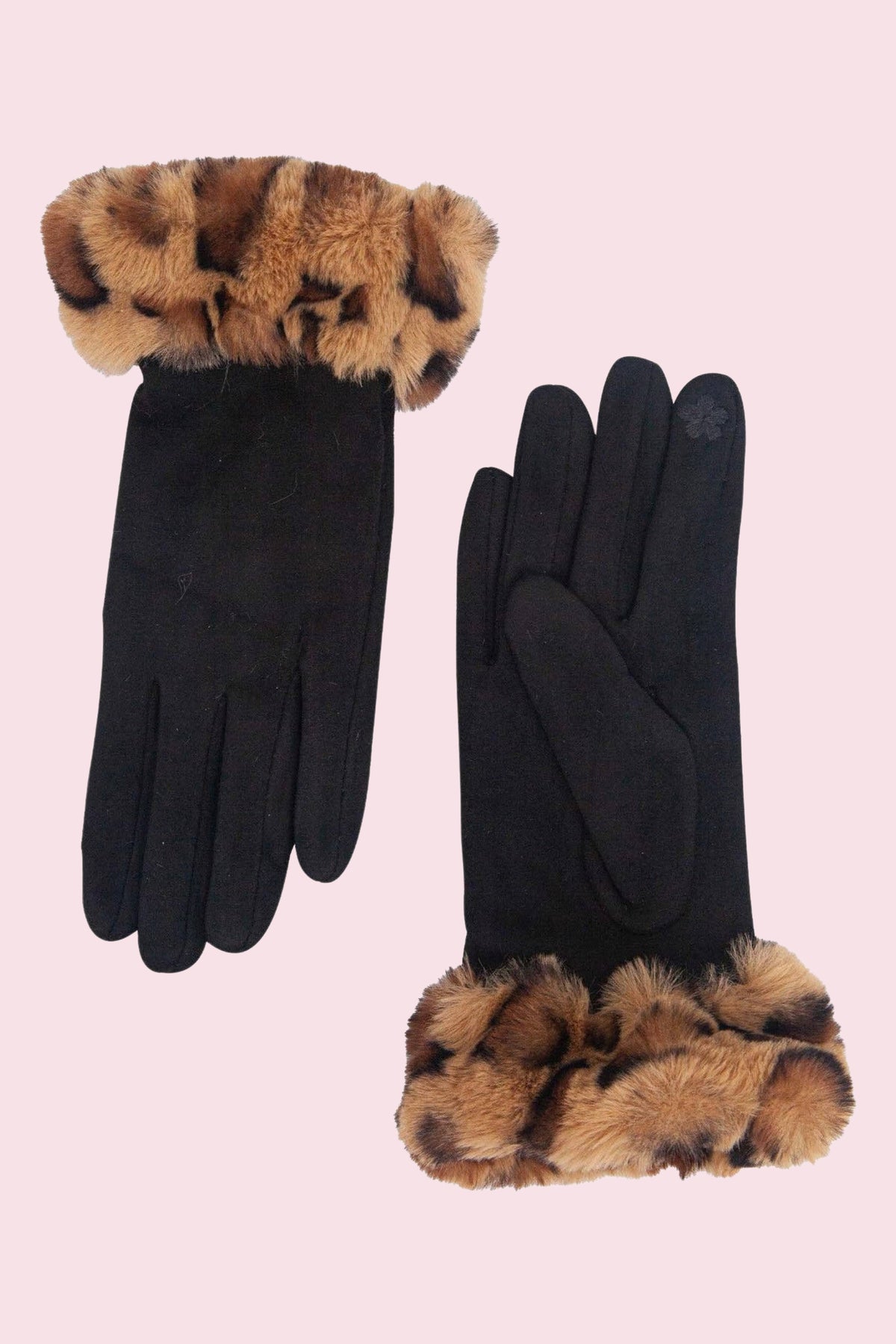 A pair of black gloves with leopard-print faux fur trim at the cuffs, displayed on a solid pale pink background.