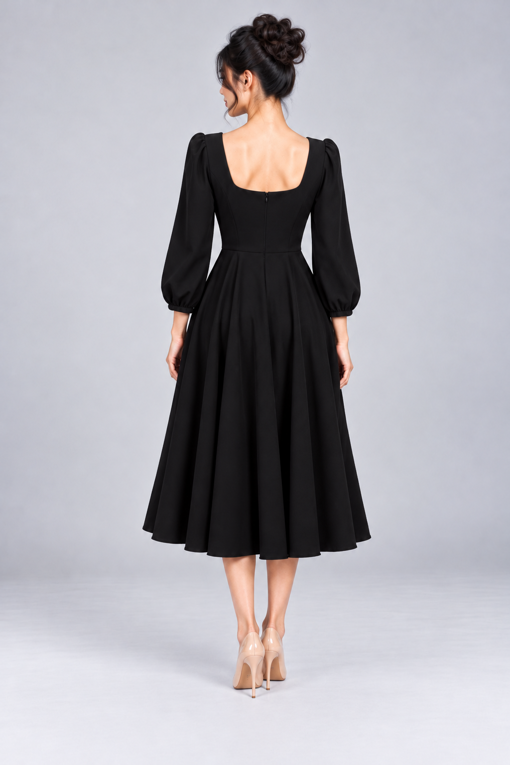 Back view of the Josette Black Swing Dress featuring a square back neckline, concealed zip and full skirt.